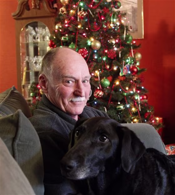 Ted Szal sits with his dog at his home Wednesday, Dec. 21, 2011, in Beaverton, Ore. Szal says he had no idea that his family back in the Chicago area feared he may have been killed by serial killer John Wayne Gacy.